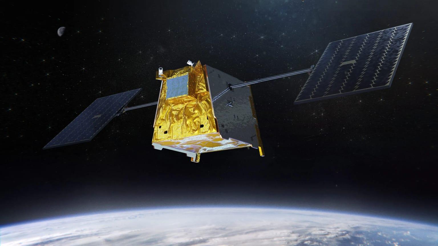 Render of a gold-foiled satellite with solar arrays above Earth
